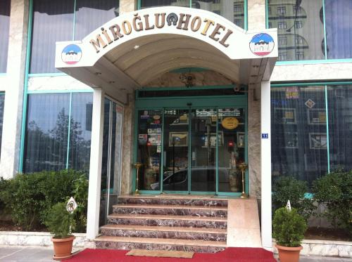 a store front of a building with a sign on it at Miroglu Hotel in Diyarbakır