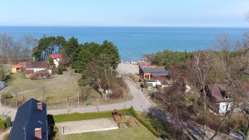 an aerial view of a town with the ocean at Prezydencki Apartamenty z widokiem na morze in Jarosławiec