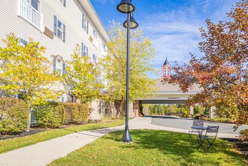 a street light in the grass next to a building at Berkshire Mountain Lodge in Pittsfield