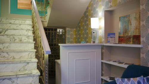 a room with a staircase and a white door at Domus Nova in Reggio Calabria