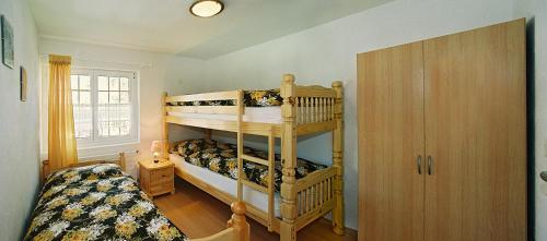 מיטה או מיטות בחדר ב-Haus Edelweiss