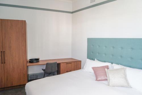 Oasis on Beamish Hotel tesisinde bir odada yatak veya yataklar