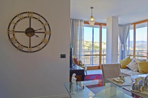 a large clock on the wall of a living room at B & B La Terrazza sul mare in Portoferraio