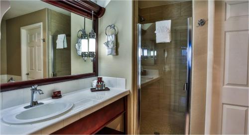 a bathroom with a sink and a shower at Tuscany Suites & Casino in Las Vegas