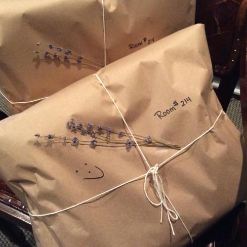a group of sewing needles on a piece of paper at Magic Castle Hotel in Los Angeles
