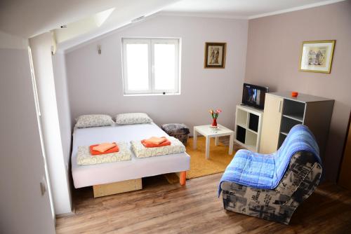 Postel nebo postele na pokoji v ubytování Athos Apartments