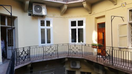 a balcony of a building with a window at Dob Twenty Rooms in Budapest