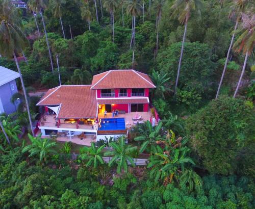 an aerial view of a house in the forest at Pink House Guest House Lamai - Pool & Sea View in Lamai