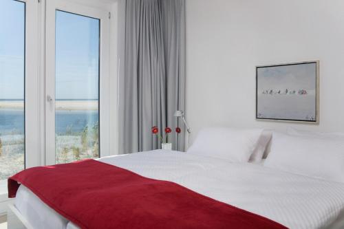 Postel nebo postele na pokoji v ubytování Ferienwohnung *Aalto*