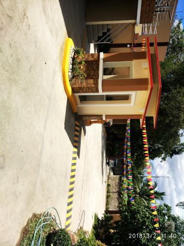 a building with multicolored stairs on the side of it at Bicotels Hotel in Batangas City