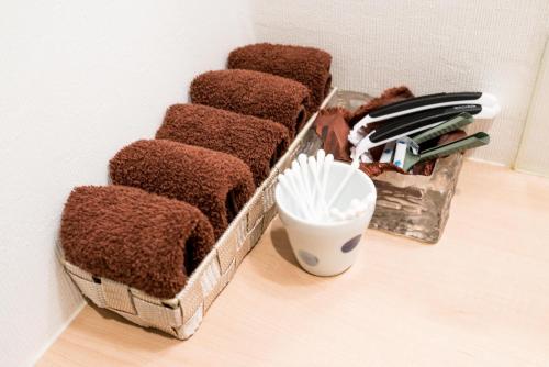 a group of baskets sitting on top of a floor at KYOTO Kazenoya Sara in Kyoto