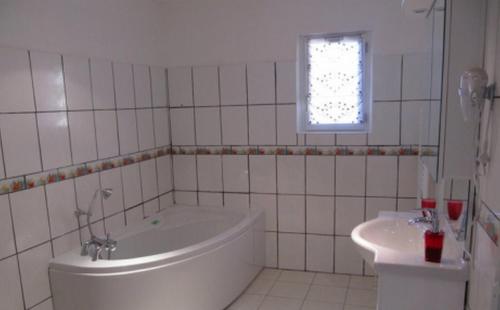Koupelna v ubytování Chambres d'hôtes - La rose des champs