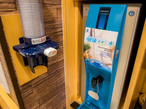 a machine in a door of a room at Super Hotel Yokkaichi Route 1 in Yokkaichi