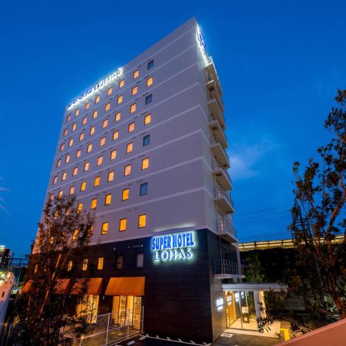 a hotel building with a sign that reads star hotel tokyo at Super Hotel Premier Musashi Kosugi Ekimae in Kawasaki