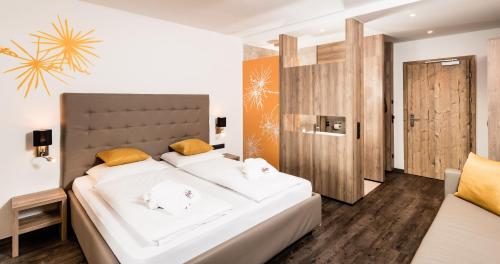 Postel nebo postele na pokoji v ubytování Hotel Almina