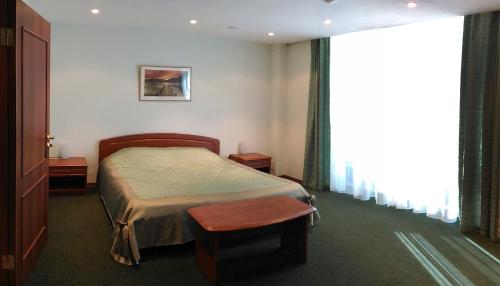 Кровать или кровати в номере Парк Виста