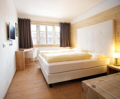 Una cama o camas en una habitación de Hotel Costabella