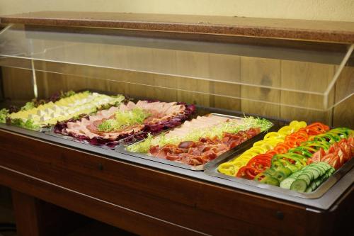 a display case filled with different types of food at Martin Hotel Prague in Prague
