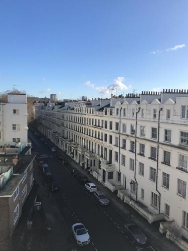 an aerial view of a city with buildings and cars at Leinster House (Bayswater) in London