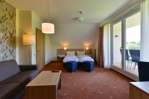 Postel nebo postele na pokoji v ubytování Schade's Wohlfühlhotel