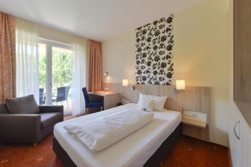 Postel nebo postele na pokoji v ubytování Schade's Wohlfühlhotel