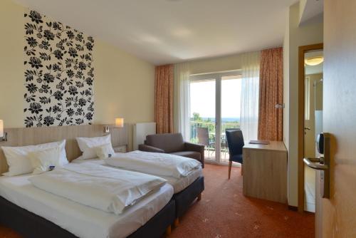 Postel nebo postele na pokoji v ubytování Schade's Wohlfühlhotel