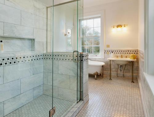 a bathroom with a shower and a sink at Eastover Estate and Eco Village in Lenox