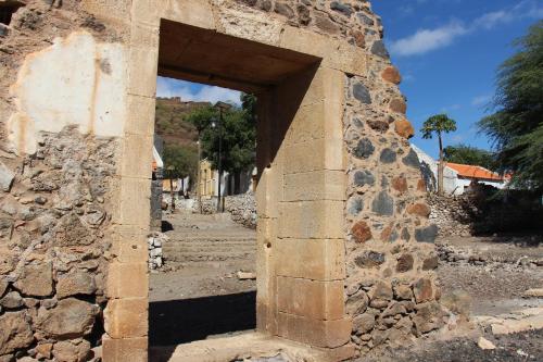 an entrance to a stone building with a doorway at Pousada Quinta Ribeirinha in Cidade Velha