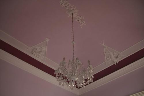 a chandelier hanging from a ceiling in a room at Maison Decò in Catania