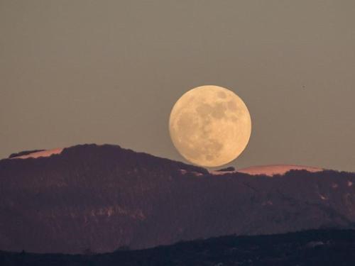 a full moon rising over a mountain range at Borgo San Michele Incisa Tuscany in Incisa in Valdarno