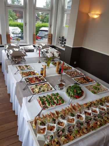 a long table with many plates of food on it at Mediterran in Hamburg