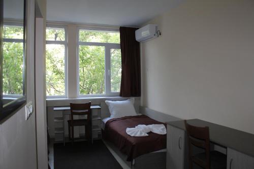A bed or beds in a room at Hostel Penev