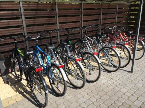 a row of bikes parked next to each other at Royal Park Hotel & Spa in Mielno