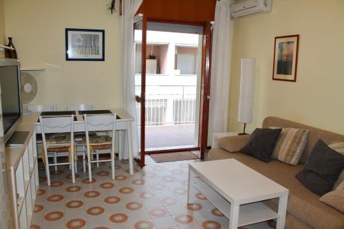 a living room with a couch and a table at Claudia 3 in Grado