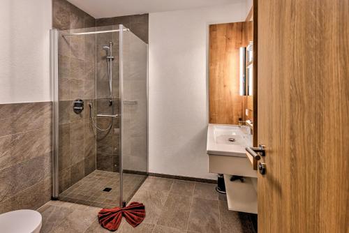 a bathroom with a shower and a sink at Hotel & Pension Traumblick in Oberhof