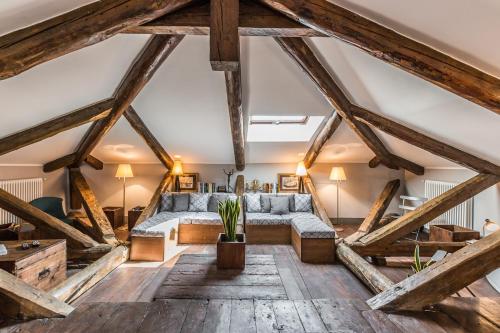 a living room with a large bed and wooden beams at Ca' Del Pittore Terrace in Venice