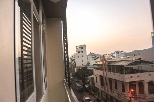 a view of a city street from an apartment window at Sun Sea Hotel in Quy Nhon
