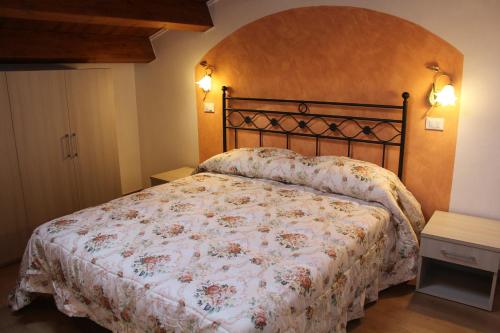 Ліжко або ліжка в номері Il Castellaro
