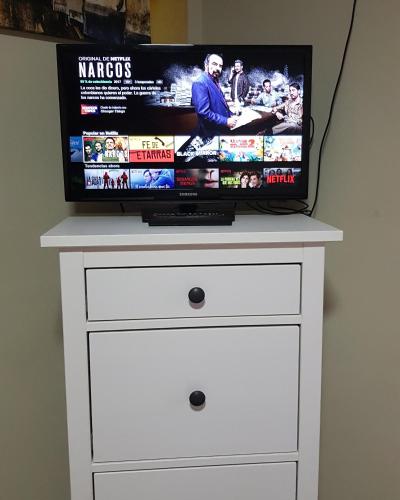 TV a/nebo společenská místnost v ubytování www apartamentovaldivia es Parking incluido
