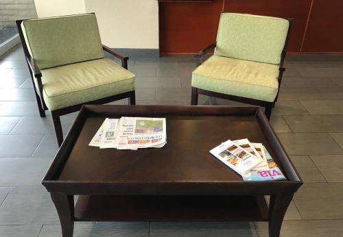 two chairs and a coffee table in a waiting room at Americas Best Value Inn Vacaville in Vacaville