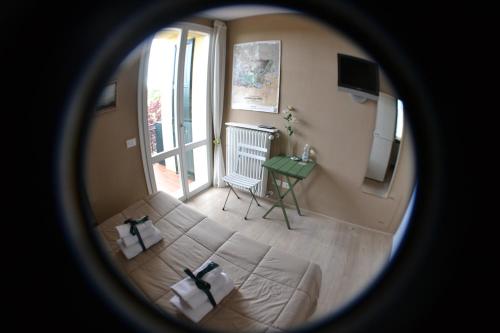 a view of a room with a bed and a window at La Combriccola in Santarcangelo di Romagna