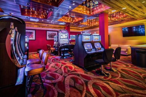 a video game room with arcade games and a gaming console at Downtown Grand Hotel & Casino in Las Vegas