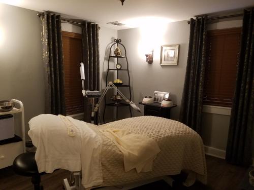 a bedroom with a bed and a lamp in it at The Inn & Spa at Intercourse Village in Intercourse