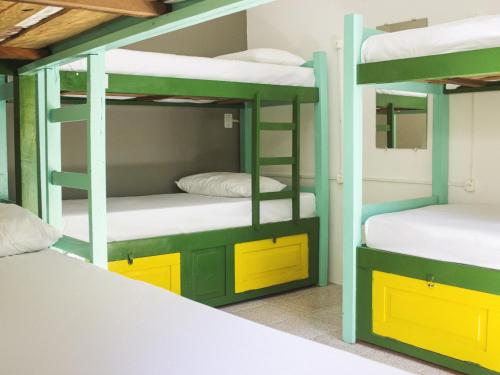 מיטה או מיטות בחדר ב-Che Lagarto Hostel Morro De São Paulo
