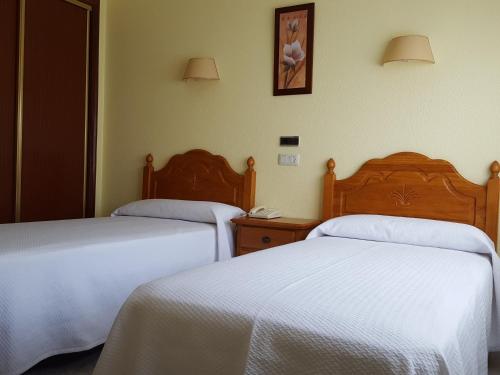 Katil atau katil-katil dalam bilik di Hotel La Costera