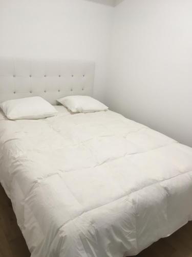 Ένα ή περισσότερα κρεβάτια σε δωμάτιο στο Residence de luxe tout confort