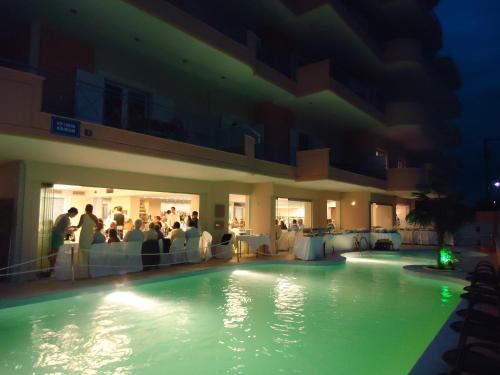 a swimming pool at a hotel at night at Philoxenia Hotel in Lefkandi Chalkidas