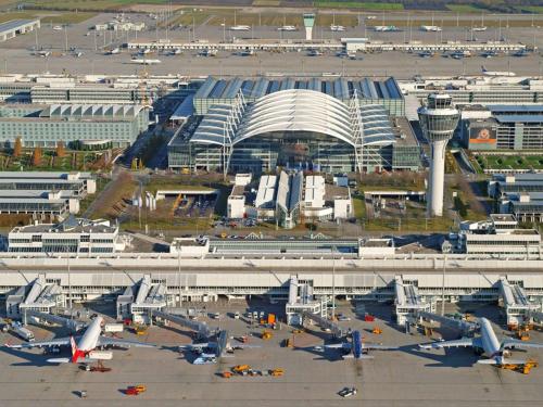 an airport with a lot of buildings and airplanes at AKZENT Hotel Aufkirchen in Aufkirchen