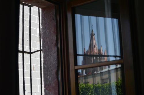 a view of a building from a window at Hotel Casa Blanca 7 in San Miguel de Allende