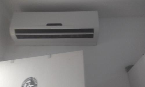 Una televisión o centro de entretenimiento en Apartamento Vog